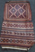 An antique kilim flatweave saddle rug,