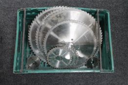 A crate of ten assorted saw blades