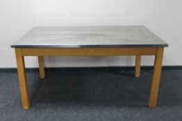 A stainless steel topped dining table
