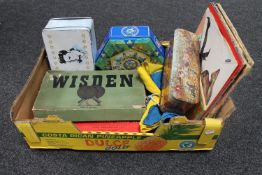 A box containing tins, Wisdon Table Tennis set, Monopoly Board game,