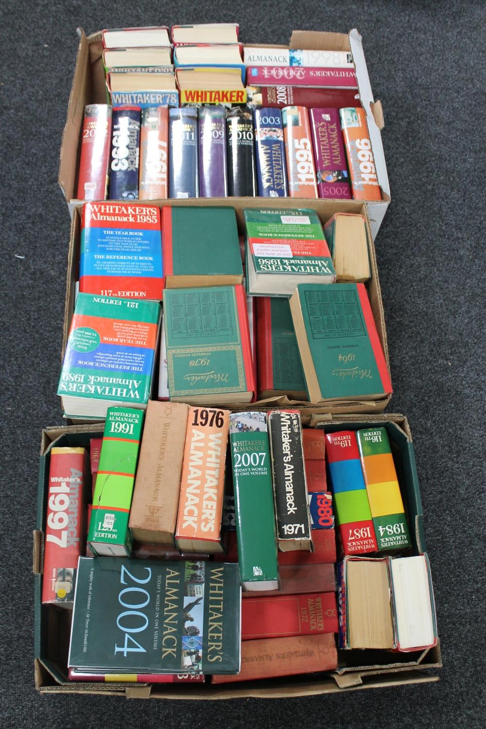 Three boxes containing a large quantity of Whitaker's Almanacks dating from 1937 to 2012 (some
