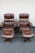 A pair of contemporary swivel adjustable relaxer chairs with stools