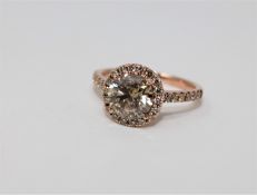 A 14ct rose gold diamond ring featuring center one round brilliant cut diamond 1.