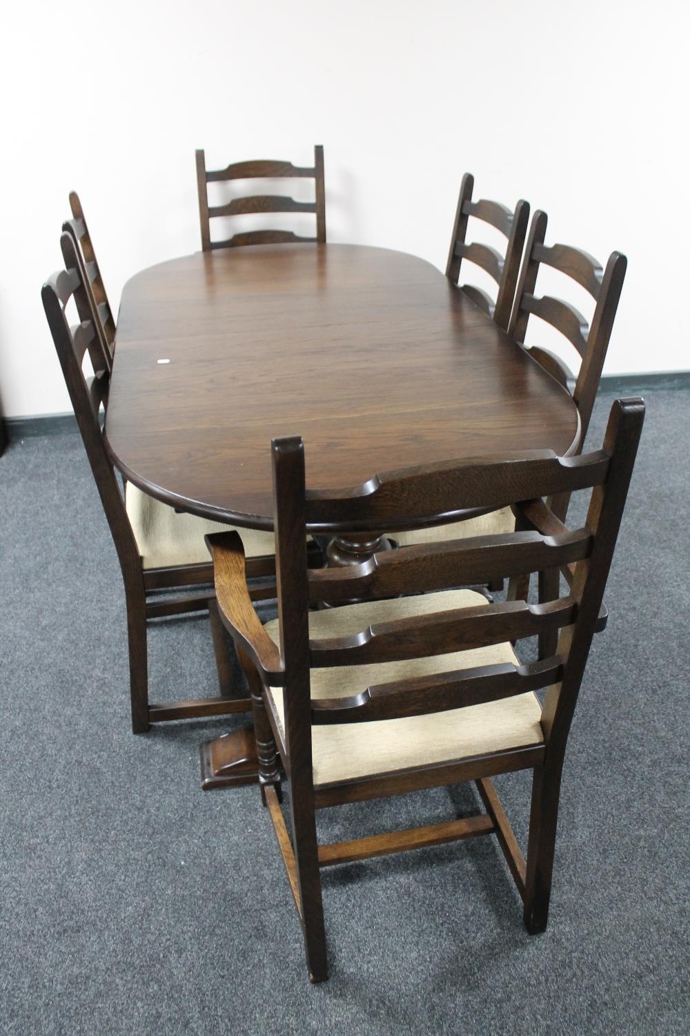 A ten piece oak dining room suite : dresser, corner display cabinet,