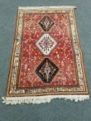 A South-West Iranian Kashgai rug on red ground 164 cm x 106 cm
