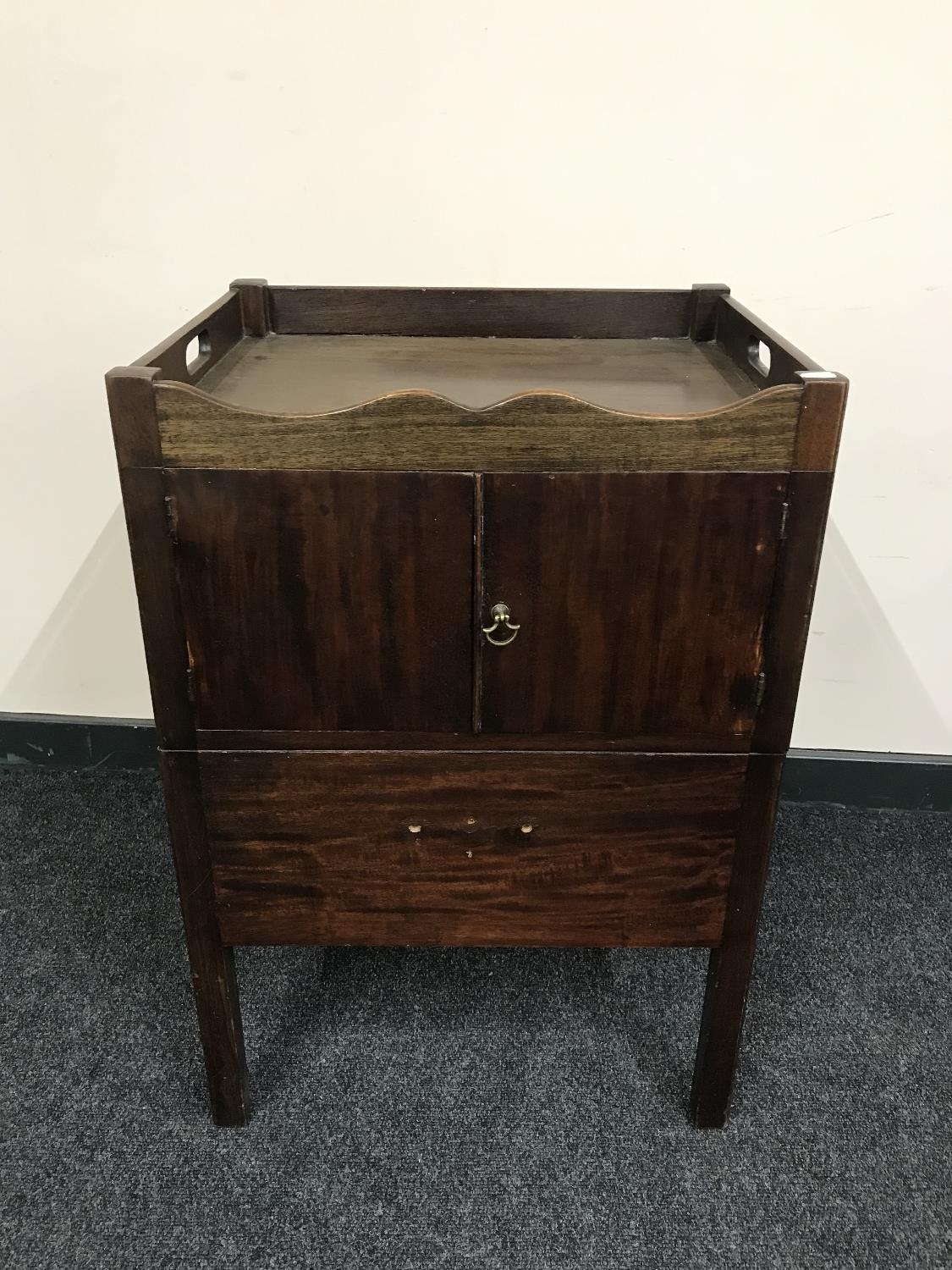 A mahogany double door pot cupboard