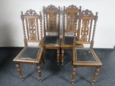 A set of four early 20th century carved oak barley twist dining chairs