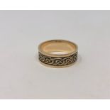 A 9ct gold Celtic knot band ring, size U CONDITION REPORT: 5.