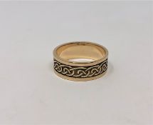 A 9ct gold Celtic knot band ring, size U CONDITION REPORT: 5.