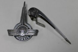 A vintage Morris car bonnet ornament and a Morris lorry badge