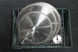A crate of ten assorted saw blades