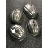 Four antique pewter food covers