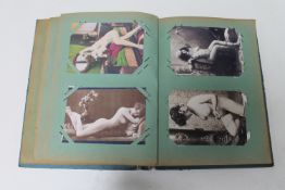 An early 20th century photograph album containing reproduction erotic pictures