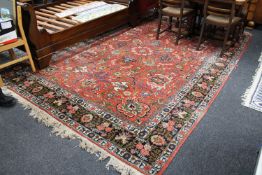 A fringed Persian carpet,