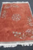 A fringed Chinese rug,