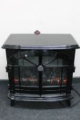 A Dimplex electric fire in the form of a stove