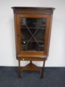 A Victorian mahogany astragal glazed corner cabinet on stand