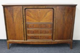 A mid 20th century continental walnut cocktail sideboard
