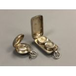 Two antique silver sovereign cases,