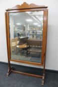 A Edwardian mahogany dressing mirror on stand