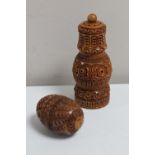 A carved Eastern condiment pot and a carved hardwood egg