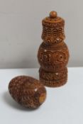 A carved Eastern condiment pot and a carved hardwood egg