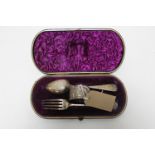 A cased silver fork and spoon with napkin ring,