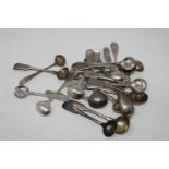 A collection of twenty-four Georgian and later silver salt and mustard spoons