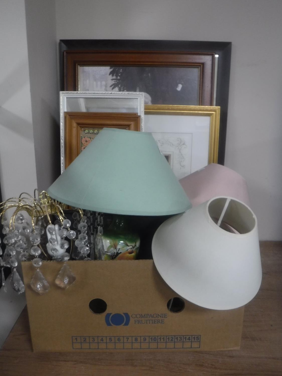 A box containing four assorted table lamps, framed prints,