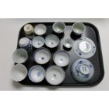 A tray of sixteen pieces of antique and later Chinese export porcelain tea bowls, rice bowls,