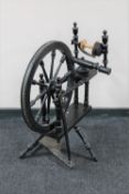 An antique ebonised spinning wheel