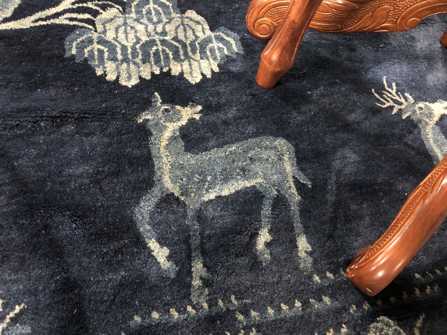 A fringed Chinese rug on blue ground depicting fauna, - Image 9 of 11