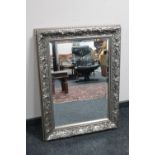 A silvered framed Art Nouveau style bevelled mirror