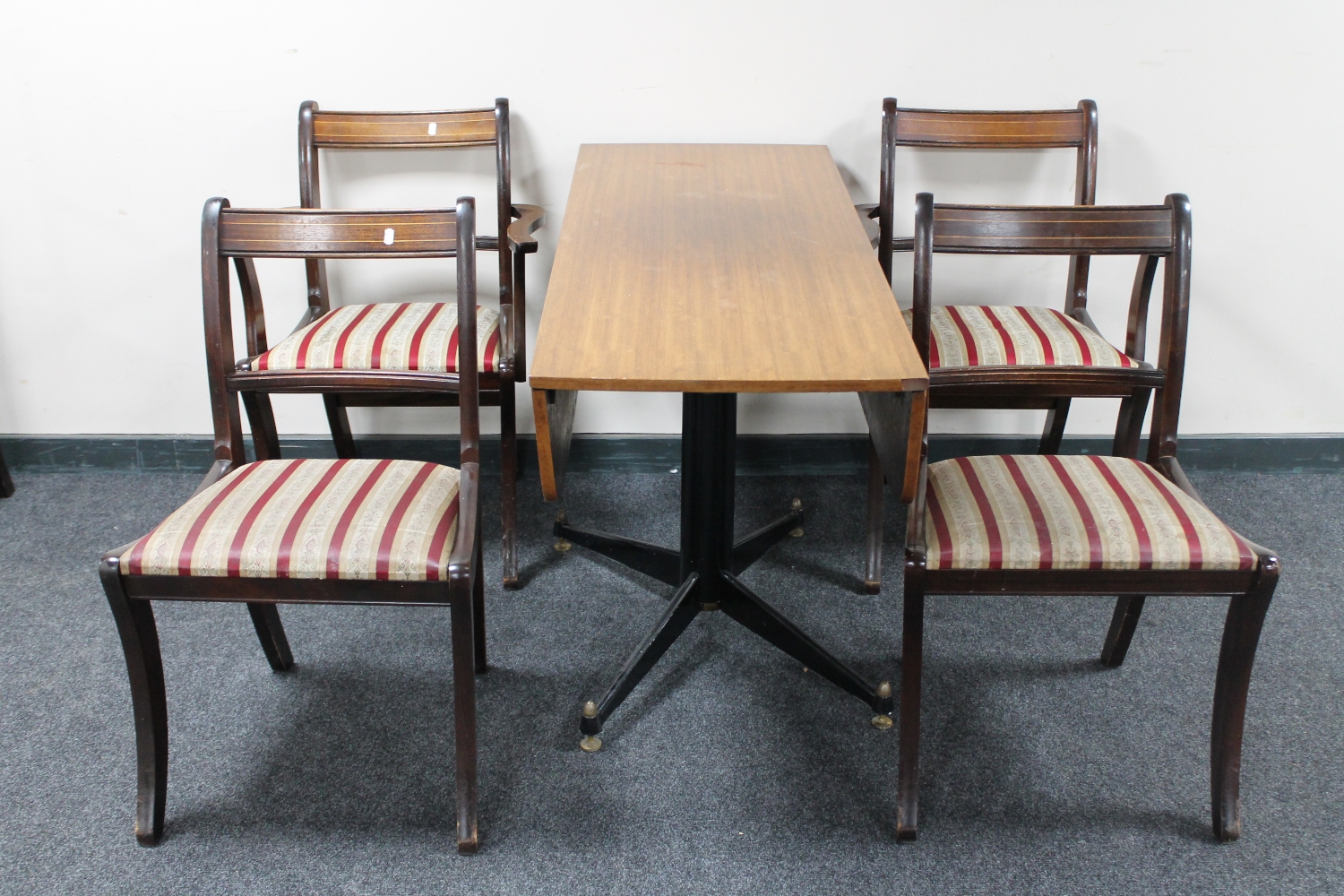 Four Regency style dining chairs and a mid 20th century teak rise and fall pedestal table