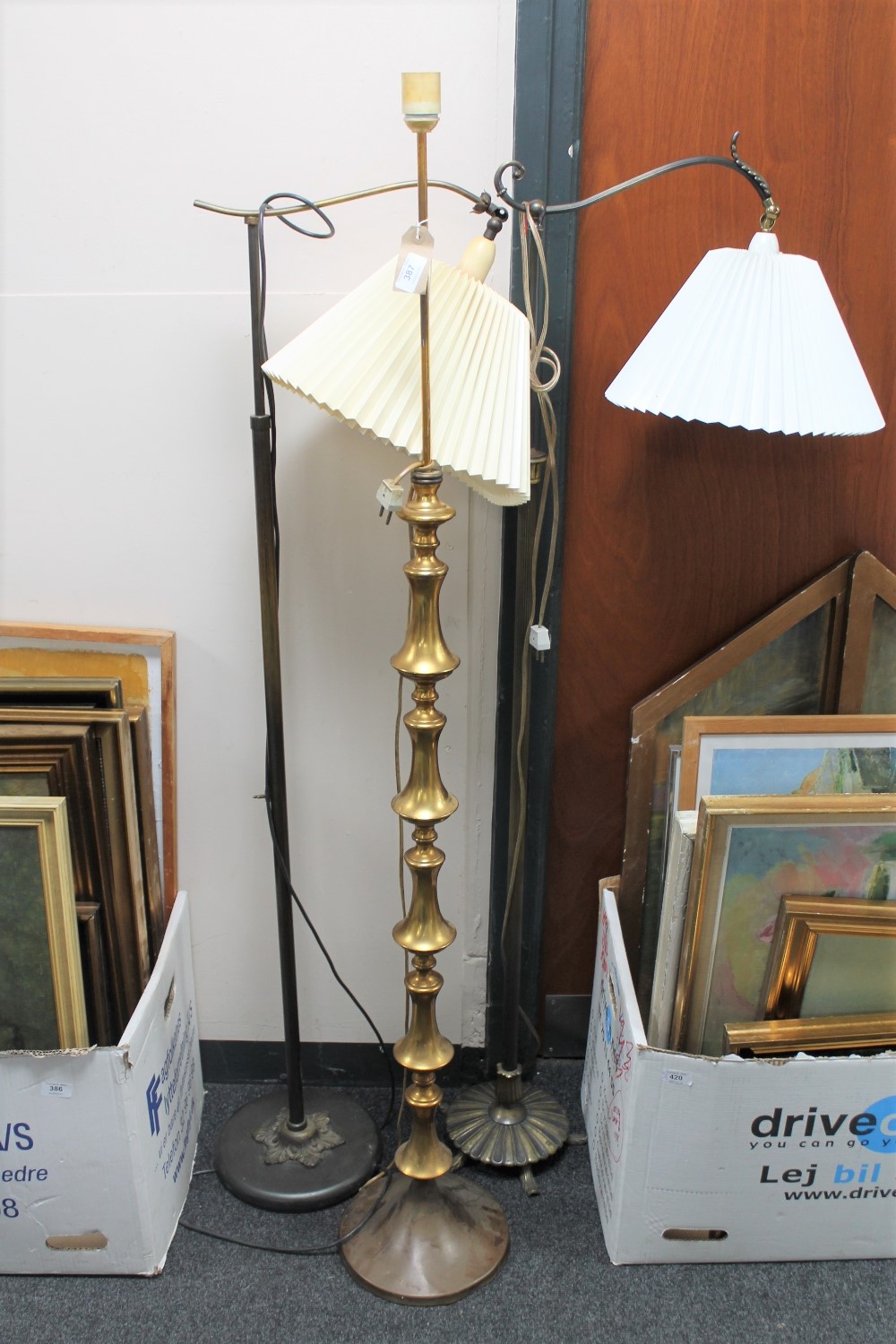 Three mid twentieth century continental floor lamps (two with shades)
