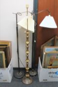 Three mid twentieth century continental floor lamps (two with shades)