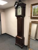 A George III mahogany eight day longcase clock with painted dial indistinctly signed, height 228 cm.