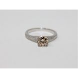 A 14ct white gold diamond solitaire ring featuring one round brilliant cut diamond 1.