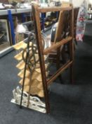 A contemporary wine rack, folding clothes airer, carpet beater, silver handled walking stick,