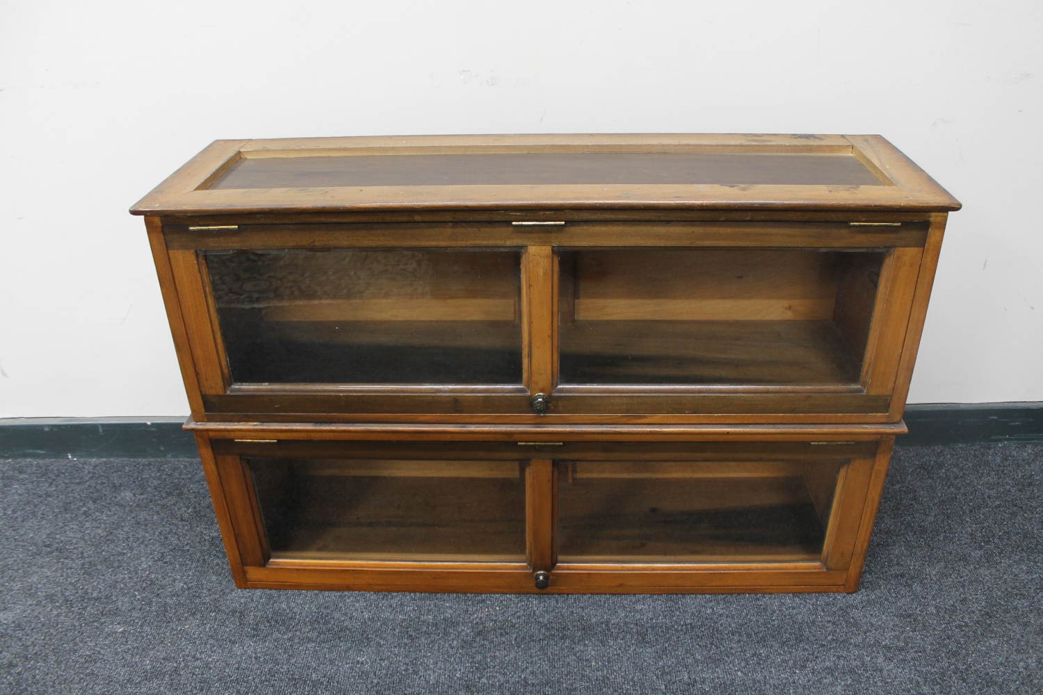 A pair of Edwardian mahogany glass door bookcases