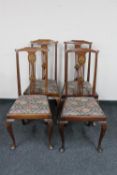 A set of four antique mahogany Queen Anne style chairs