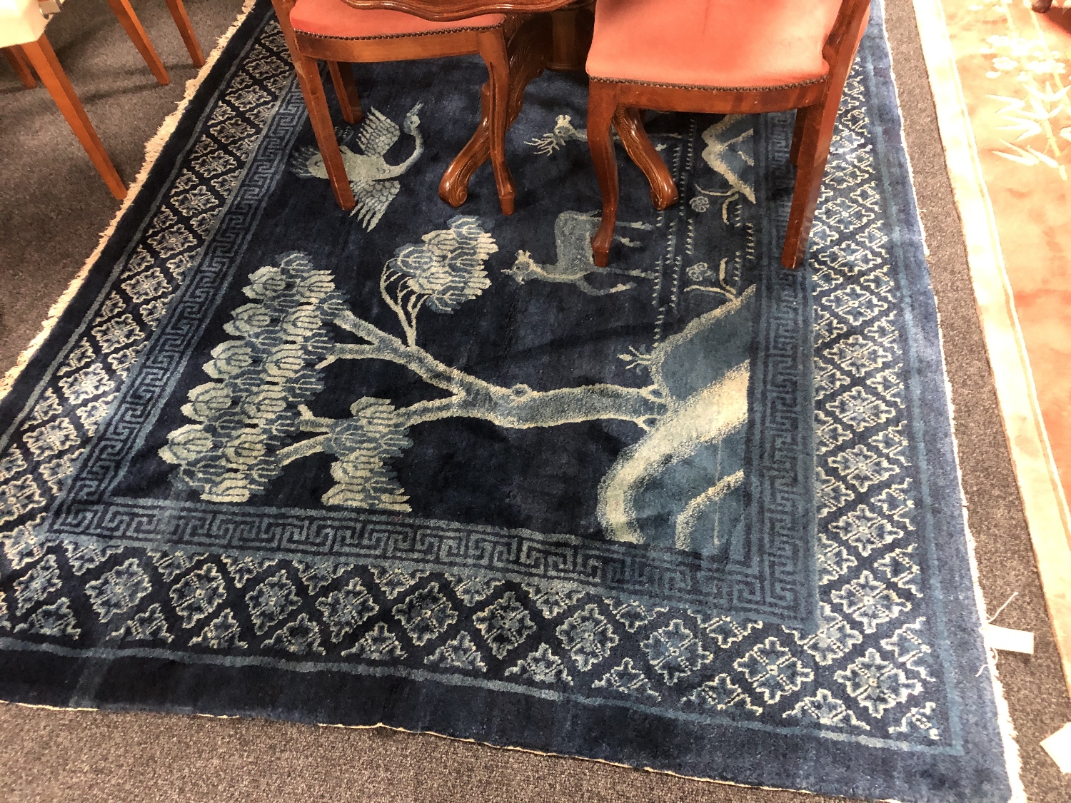 A fringed Chinese rug on blue ground depicting fauna, - Image 7 of 11
