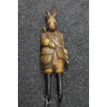 A carved wooden wall bracket in the form of a rabbit