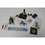 A box of miscellaneous collectable's : hand painted lead figure, military badges, buttons, medals,