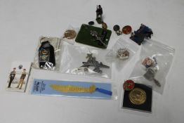 A box of miscellaneous collectable's : hand painted lead figure, military badges, buttons, medals,