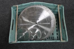 A crate of ten assorted saw blades