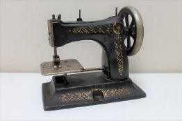 An early 20th century child's sewing machine