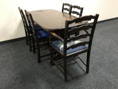 An Ercol refectory table and five oak chairs