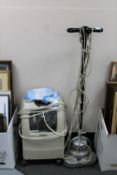 A Nilfisk floor polisher together with an Invacare perfecto two home oxygen concentrator