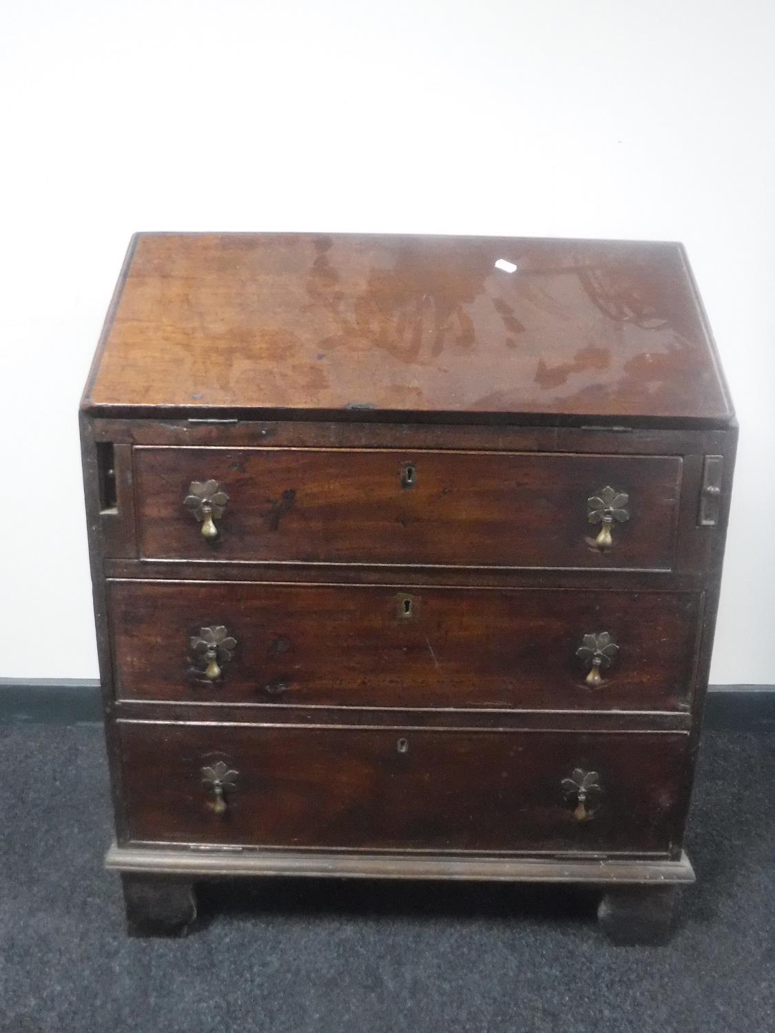 A George III mahogany writing bureau of small proportions